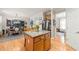 Open-concept kitchen with an island, stainless steel appliances, and easy access to the dining area at 112 Nelson Ln, Clayton, NC 27527