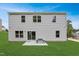 Backyard featuring a vinyl-sided house with a large grassy area and patio at 112 Sagamore Avenue, Angier, NC 27501