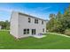 Backyard featuring a vinyl-sided house with a large grassy area at 112 Sagamore Avenue, Angier, NC 27501