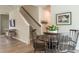 Dining area showcasing a dark wood table, chairs, and access to the staircase at 112 Sagamore Avenue, Angier, NC 27501