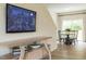 Living room area with hardwood floors, a media console, a TV, and a dining area at 112 Sagamore Avenue, Angier, NC 27501