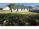 View of the house and backyard, showcasing the lawn and landscaping at 118 Hawthorn Dr, Clayton, NC 27520