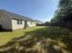 Large, grassy backyard with wooden fence offering privacy and space for recreation at 118 Hawthorn Dr, Clayton, NC 27520