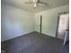 Spacious bedroom with neutral carpet, ceiling fan, and natural light at 118 Hawthorn Dr, Clayton, NC 27520