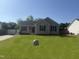 Charming single-story home with blue shutters and a well-maintained lawn at 118 Hawthorn Dr, Clayton, NC 27520