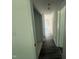 Hallway view features vinyl floors and doors to other rooms at 118 Hawthorn Dr, Clayton, NC 27520