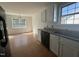 Kitchen featuring granite countertops, white cabinets, and stainless steel dishwasher at 118 Hawthorn Dr, Clayton, NC 27520