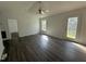 Living Room boasts stylish flooring, natural light, and a backyard entrance at 118 Hawthorn Dr, Clayton, NC 27520