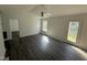 Well-lit living area with backyard access and durable floors at 118 Hawthorn Dr, Clayton, NC 27520