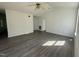 Bright living room with vaulted ceiling, ceiling fan, and luxury vinyl plank flooring at 118 Hawthorn Dr, Clayton, NC 27520