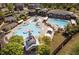 Aerial view of the community pool and recreation area with multiple pools and playground at 1212 Sand Pine Dr, Cary, NC 27519
