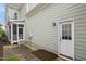 Exterior view of the home with patio, screened porch, and backyard access at 1212 Sand Pine Dr, Cary, NC 27519