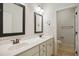 Bathroom featuring double sink vanity with white countertop and cabinet at 1212 Sand Pine Dr, Cary, NC 27519