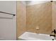 Bright bathroom featuring tiled tub and shower at 1212 Sand Pine Dr, Cary, NC 27519