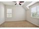 Bedroom features neutral carpeting, ceiling fan, and natural light at 1212 Sand Pine Dr, Cary, NC 27519