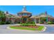 Exterior shot of the community clubhouse, featuring a circular driveway and well-maintained landscaping at 1212 Sand Pine Dr, Cary, NC 27519
