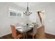 Dining room features modern chandelier, wooden floors, and natural light at 1212 Sand Pine Dr, Cary, NC 27519