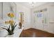 Inviting foyer featuring hardwood floors, wainscoting, and a bright front door with sidelights at 1212 Sand Pine Dr, Cary, NC 27519