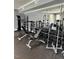 Community gym featuring weightlifting machines, free weights and floor to ceiling mirrors at 1212 Sand Pine Dr, Cary, NC 27519