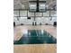 Indoor basketball gymnasium with score board at 1212 Sand Pine Dr, Cary, NC 27519