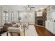 Cozy living room with a stone fireplace, large windows, and comfortable seating at 1212 Sand Pine Dr, Cary, NC 27519