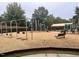 Community playground featuring swings, slides and tic-tac-toe game at 1212 Sand Pine Dr, Cary, NC 27519