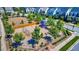 Community playground with swings and slides in a neighborhood with inviting homes and neatly manicured lawns at 1212 Sand Pine Dr, Cary, NC 27519
