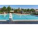 Community pool with lifeguard stand and lounge chairs under covered patio at 1212 Sand Pine Dr, Cary, NC 27519