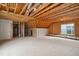 Unfinished space ready for customization with exposed wood and a window view at 1212 Sand Pine Dr, Cary, NC 27519