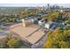 Aerial view of new homes with construction sites and nearby city at 1238 Coach Station Aly # 101, Raleigh, NC 27601