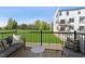 Balcony featuring outdoor seating with view of lawn and surrounding buildings at 1238 Coach Station Aly # 101, Raleigh, NC 27601