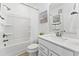 Bright bathroom featuring a shower and tub combo, white vanity, quartz counters, and brushed nickel hardware at 1238 Coach Station Aly # 101, Raleigh, NC 27601