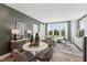 Open floor plan with dining area, living room, and large window offering natural light and a view at 1238 Coach Station Aly # 101, Raleigh, NC 27601