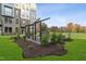 Inviting outdoor courtyard with seating area surrounded by green space and landscaping at 1242 Coach Station Aly # 101, Raleigh, NC 27601