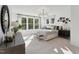 Bright and open main bedroom with modern decor, large windows, and a serene atmosphere at 1242 Coach Station Aly # 101, Raleigh, NC 27601