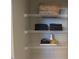 A closet features wire shelving with neatly folded towels and decorative baskets at 128 Sagamore Avenue, Angier, NC 27501