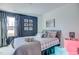 Stylish bedroom with blue accent wall, queen bed, and modern decor at 129 Sagamore Ave., Angier, NC 27501