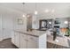 Kitchen island with granite countertop, dining area, and living room with fireplace in the background at 129 Sagamore Ave., Angier, NC 27501