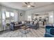Spacious living room with a view to the kitchen, dining area, comfortable seating, and natural light at 129 Sagamore Ave., Angier, NC 27501