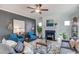 Inviting living room featuring a fireplace, comfortable seating, modern decor, and ample natural light at 129 Sagamore Ave., Angier, NC 27501