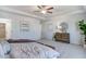 Bright main bedroom with tray ceiling, hardwood floors, and neutral walls at 129 Sagamore Ave., Angier, NC 27501