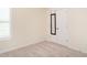 Well-lit bedroom providing neutral carpeting, closet, and natural light from the window at 1307 Montreux Ct, Mebane, NC 27302