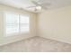 Bright bedroom boasting neutral carpeting and plantation shutters for privacy and light control at 1307 Montreux Ct, Mebane, NC 27302