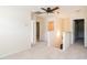Upstairs hallway with neutral carpet, open doors, and a staircase landing at 1307 Montreux Ct, Mebane, NC 27302