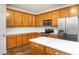 The lovely kitchen includes quartz countertops, stainless steel appliances, and cabinets for storage at 1307 Montreux Ct, Mebane, NC 27302
