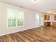 Bright living room with wood-look floors and lots of natural light at 1307 Montreux Ct, Mebane, NC 27302