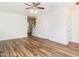 An expansive living room with modern flooring, a view of the stairs, and white trim at 1307 Montreux Ct, Mebane, NC 27302