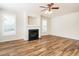Spacious living room with a fireplace and abundant natural light through large windows at 1307 Montreux Ct, Mebane, NC 27302