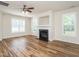 Inviting living room with a fireplace and lots of windows providing great natural light at 1307 Montreux Ct, Mebane, NC 27302