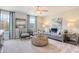 Cozy living room with large windows, neutral decor, comfortable seating, and carpeted floors at 132 Sagamore Avenue, Angier, NC 27501